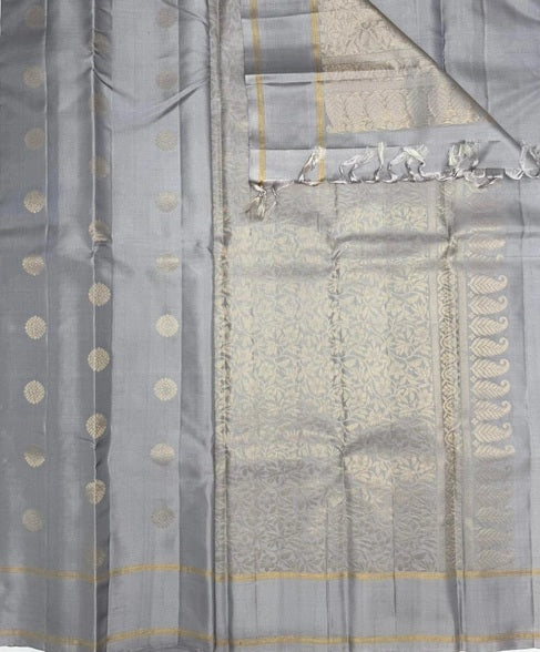 Kanima light grey color body, pallu , blouse pure silk saree