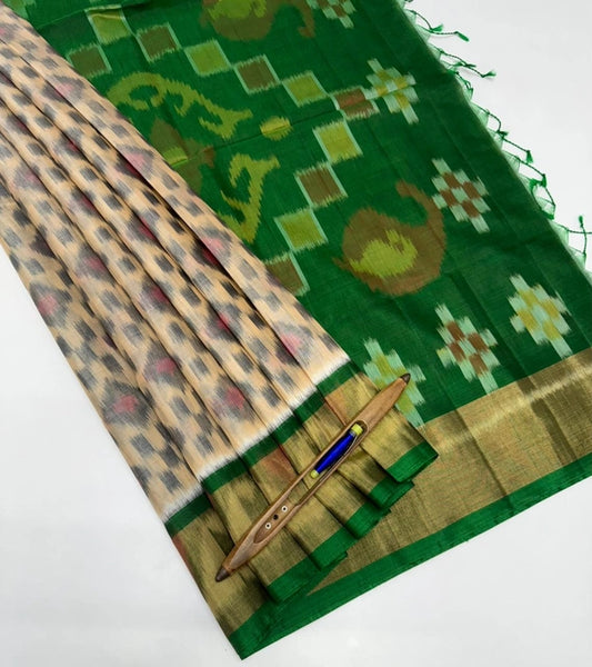 Vaana pochampally silk cotton saree light sandal color body & green color pallu , blouse.