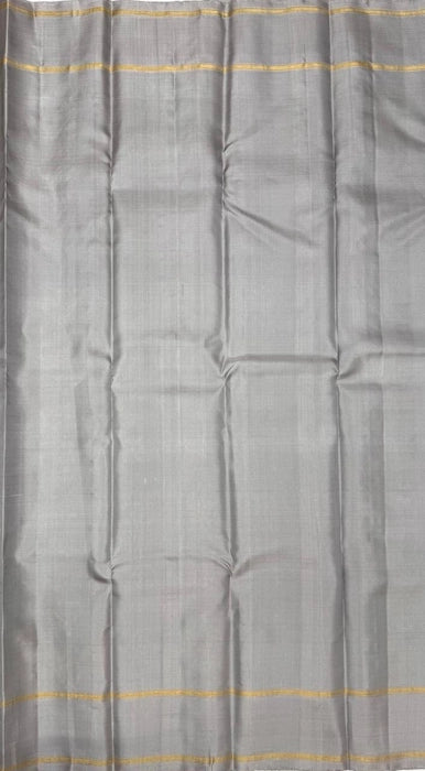 Kanima light grey color body, pallu , blouse pure silk saree