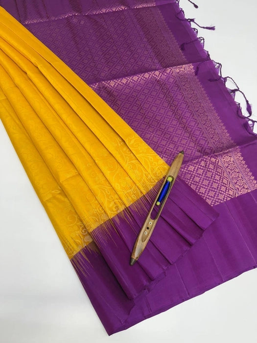 Kanaka bright yellow color body & violet color pallu , blouse pure silk saree